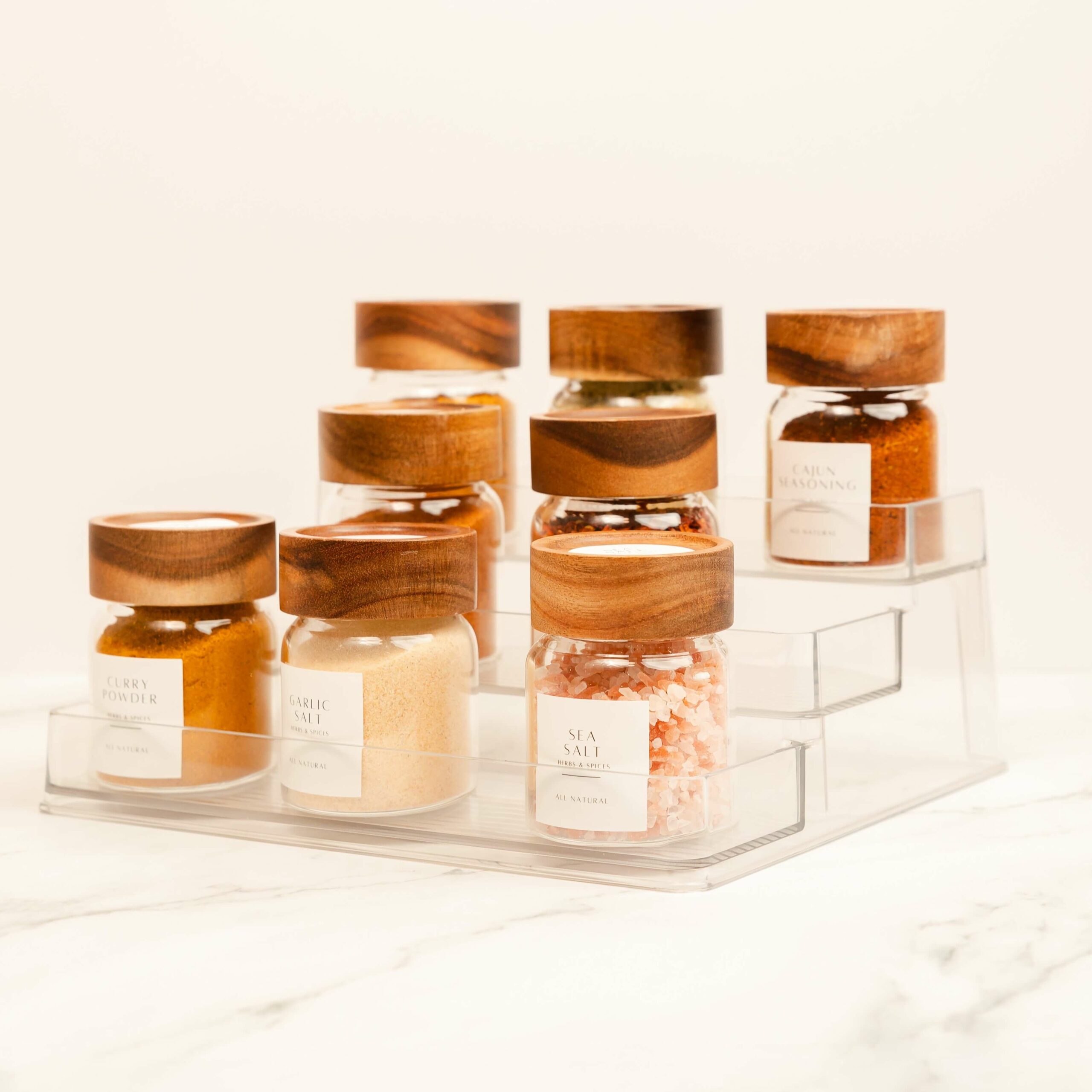 Neatly organized spice jars on a stylish rack